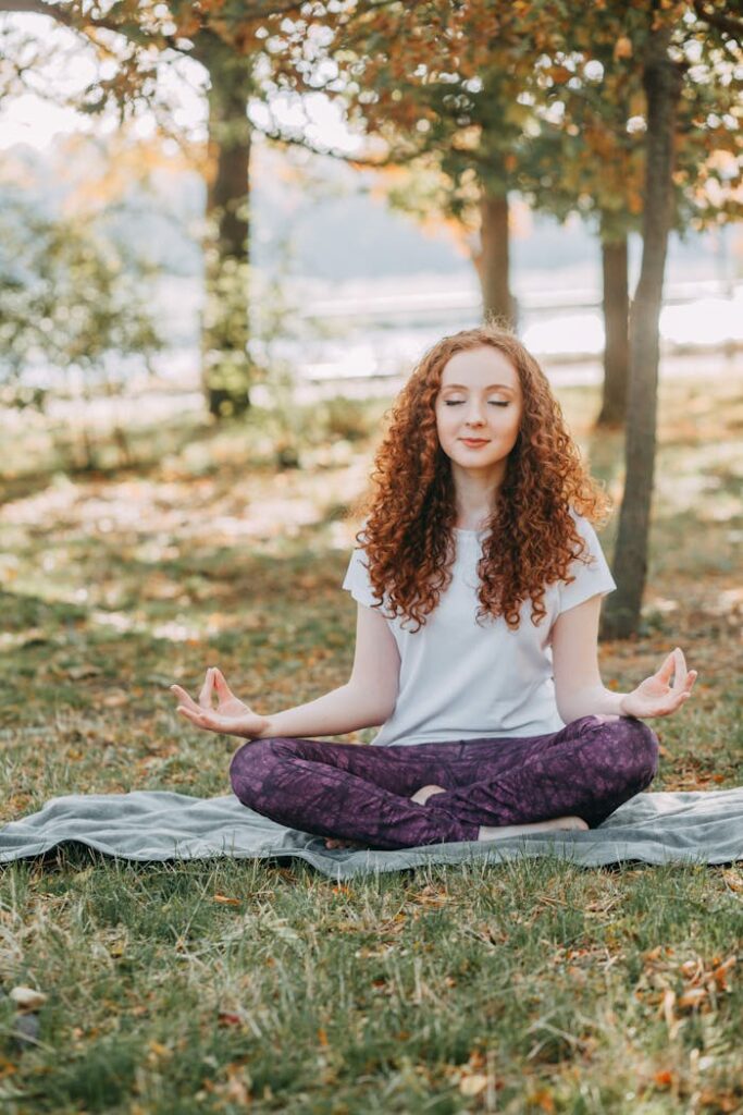 A serene woman practicing meditation, embodying tranquility and mindfulness, perfectly reflecting our commitment to providing inspiring health blogs focused on well-being and personal growth.